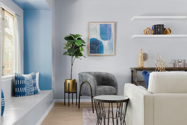 sitting room featuring hardwood / wood-style flooring