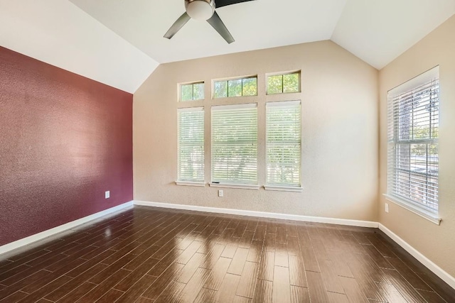 unfurnished room with lofted ceiling, ceiling fan, and dark wood-type flooring