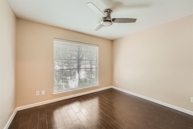 unfurnished room featuring ceiling fan and dark hardwood / wood-style flooring