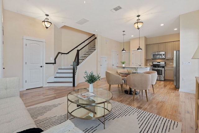 living room with light hardwood / wood-style floors