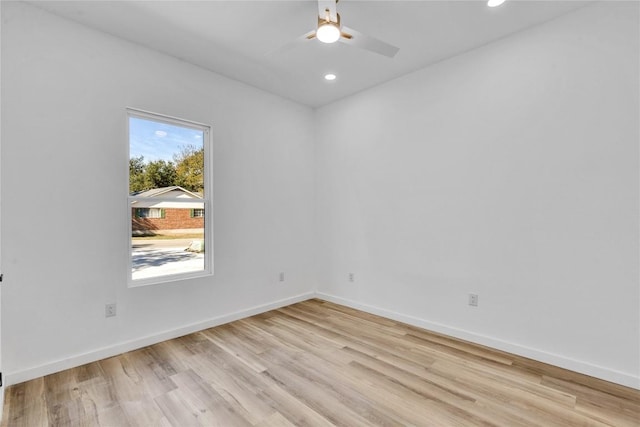 empty room with light wood-type flooring and ceiling fan