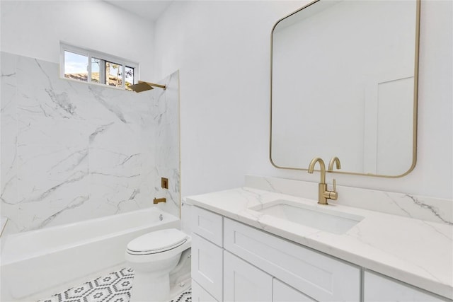 full bathroom featuring toilet, vanity, and tiled shower / bath