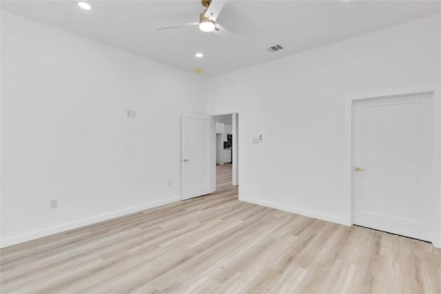 spare room with ceiling fan and light hardwood / wood-style floors