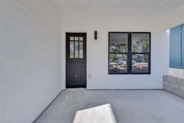 property entrance with a patio area