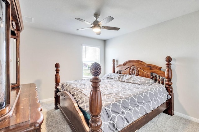 bedroom featuring light colored carpet and ceiling fan