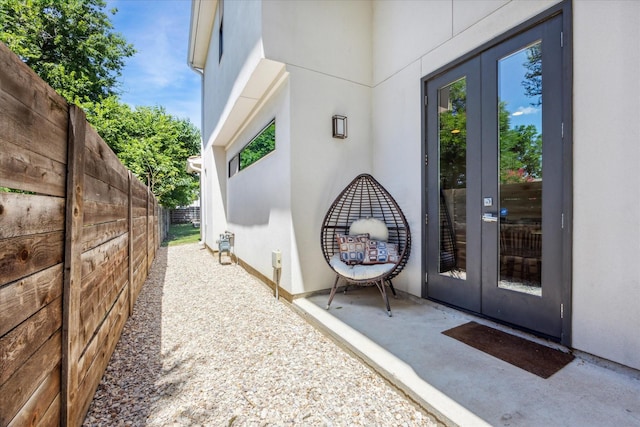 view of exterior entry featuring french doors