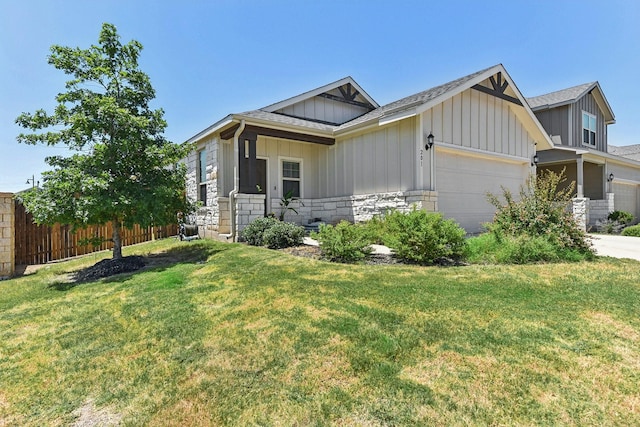 view of front of home featuring a front lawn and a garage