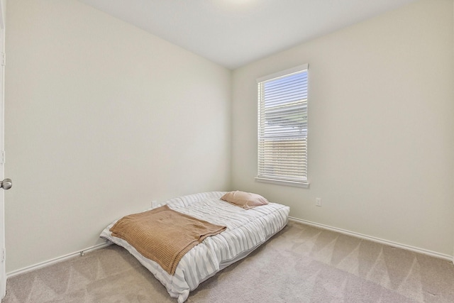 bedroom with light carpet