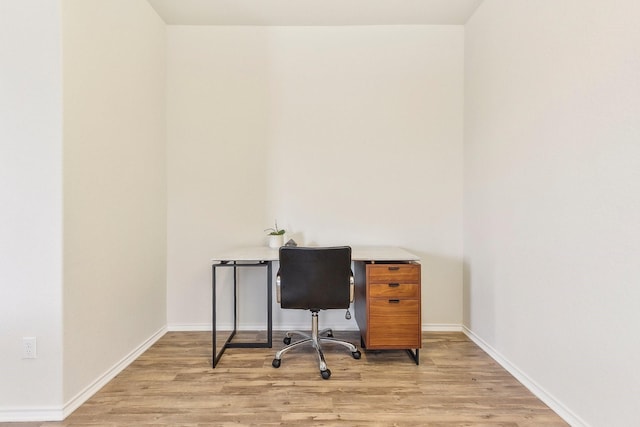 office area with light hardwood / wood-style flooring