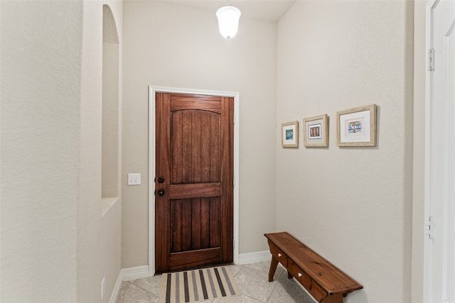 entryway with light tile patterned floors