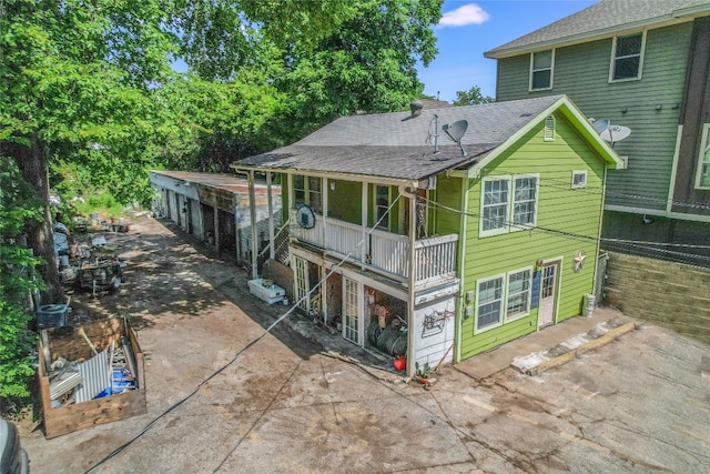 back of house with a patio area