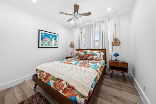 bedroom featuring dark hardwood / wood-style floors and ceiling fan