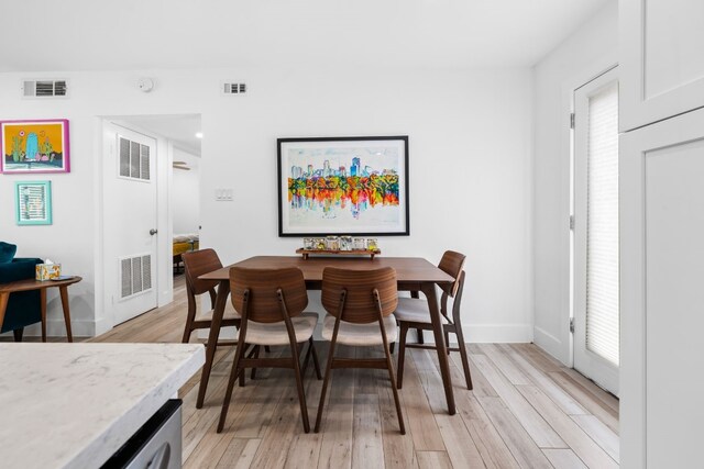 dining space featuring light hardwood / wood-style floors