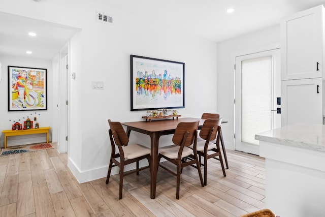 dining room featuring light hardwood / wood-style flooring