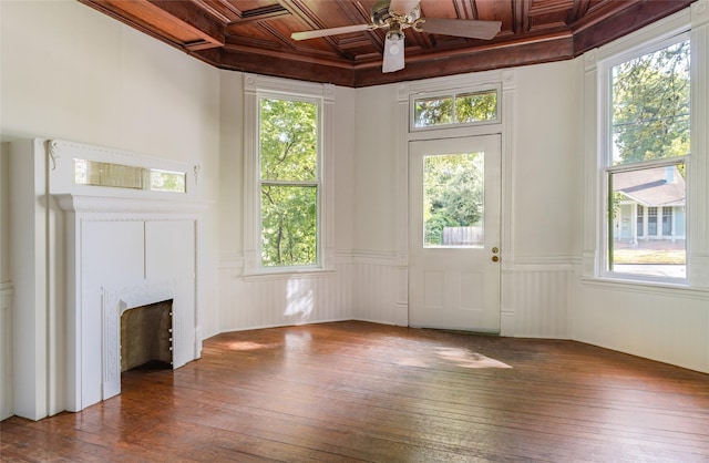 unfurnished living room with wood ceiling, ceiling fan, coffered ceiling, and dark wood-type flooring