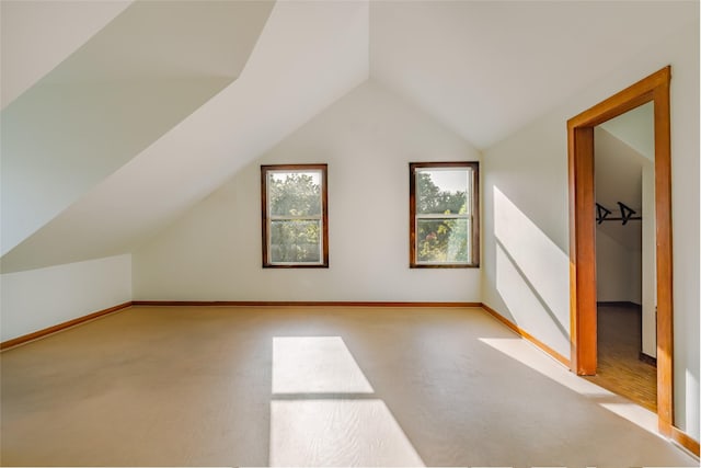 bonus room with lofted ceiling and plenty of natural light