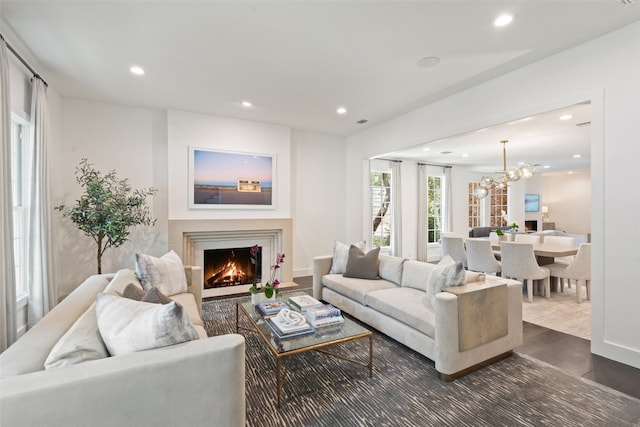 living room featuring dark hardwood / wood-style flooring and a notable chandelier