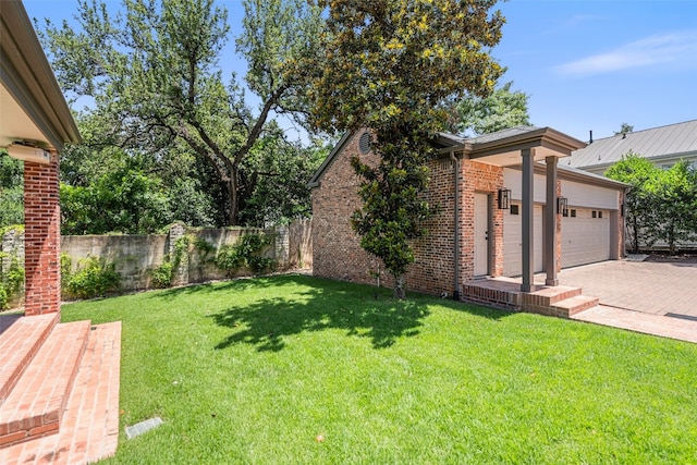 view of yard featuring a garage