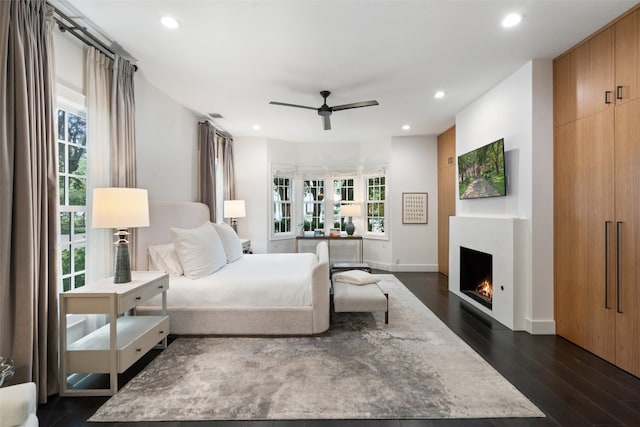 bedroom featuring dark hardwood / wood-style flooring and ceiling fan