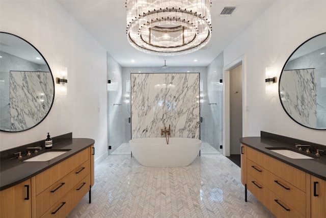 bathroom with tiled shower, tile patterned flooring, and double vanity