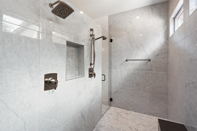 bathroom with tiled shower