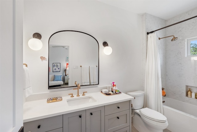 full bathroom featuring vanity, toilet, and shower / bath combination with curtain