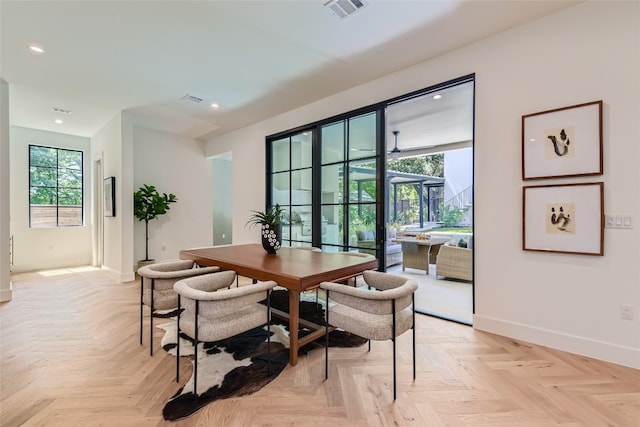 dining space with light parquet floors