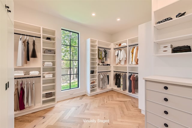 walk in closet featuring light parquet floors