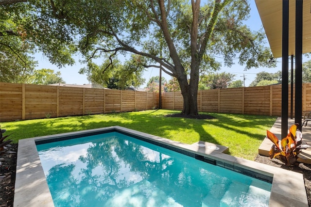 view of pool featuring a yard