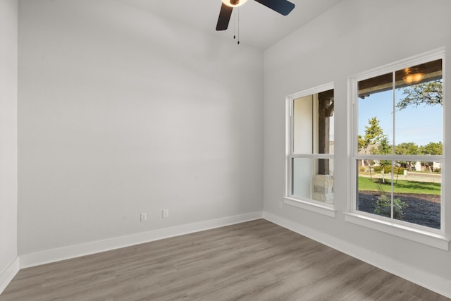 spare room featuring hardwood / wood-style floors and ceiling fan