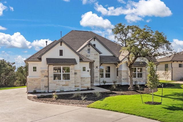 french country home with a front yard