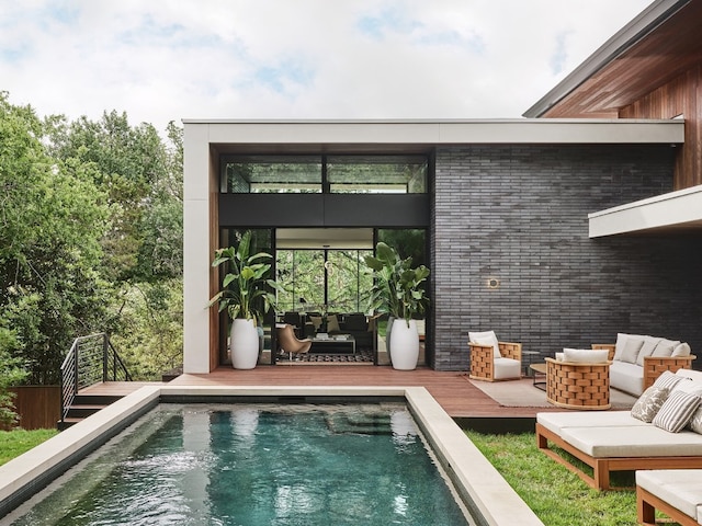 view of swimming pool with a wooden deck