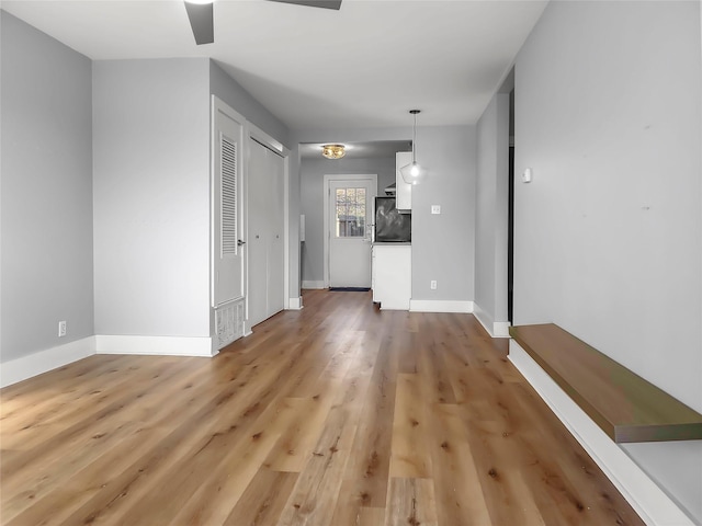 unfurnished living room with wood-type flooring