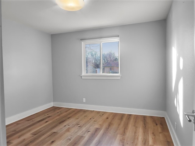 spare room featuring light wood-type flooring