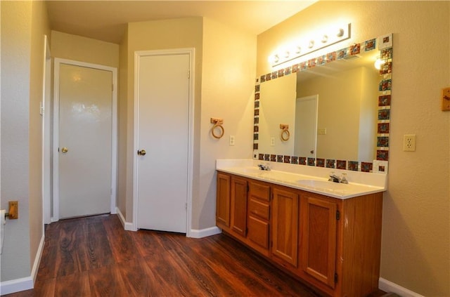 bathroom featuring vanity and hardwood / wood-style flooring