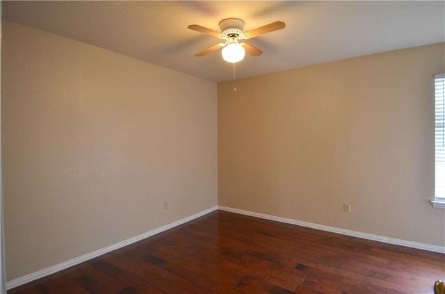 unfurnished room featuring ceiling fan and dark wood-type flooring