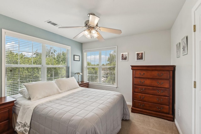 bedroom with light colored carpet and ceiling fan