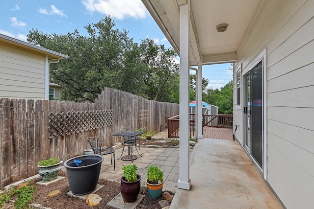 view of patio with a storage unit