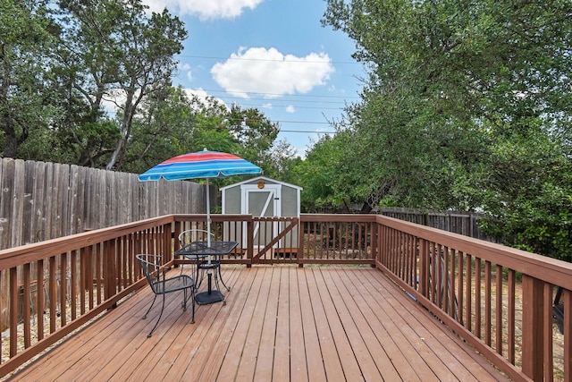 wooden terrace with a shed