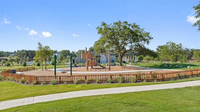 exterior space featuring a playground and a yard