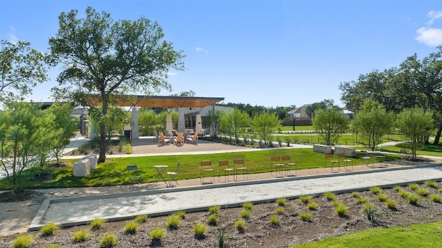 view of property's community with a lawn