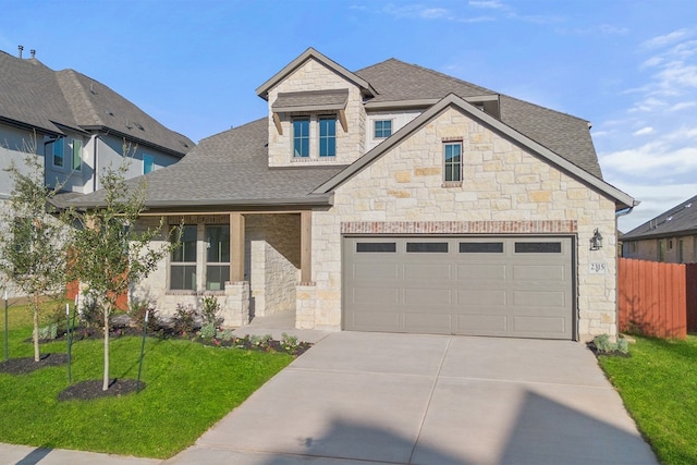 view of front of home with a garage and a front yard