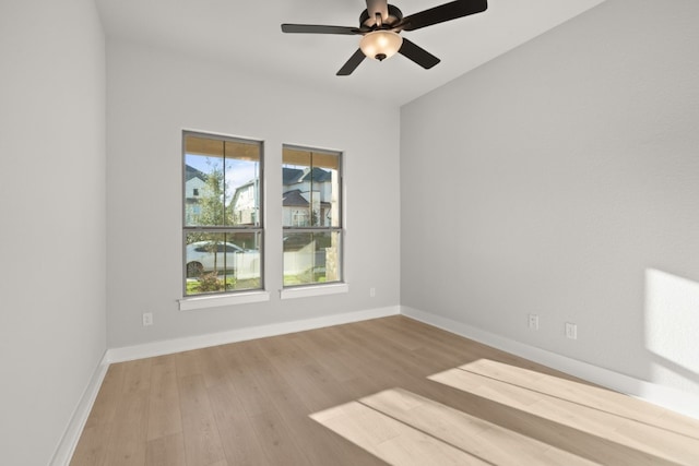 unfurnished room featuring light wood-type flooring and ceiling fan