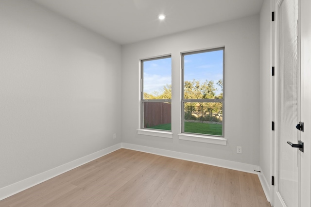 spare room featuring light hardwood / wood-style floors