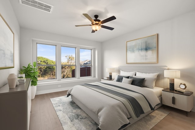 bedroom featuring hardwood / wood-style floors and ceiling fan