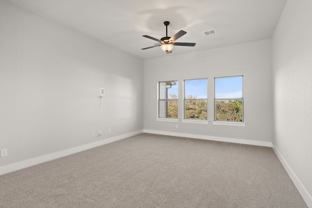 unfurnished room featuring ceiling fan and carpet flooring