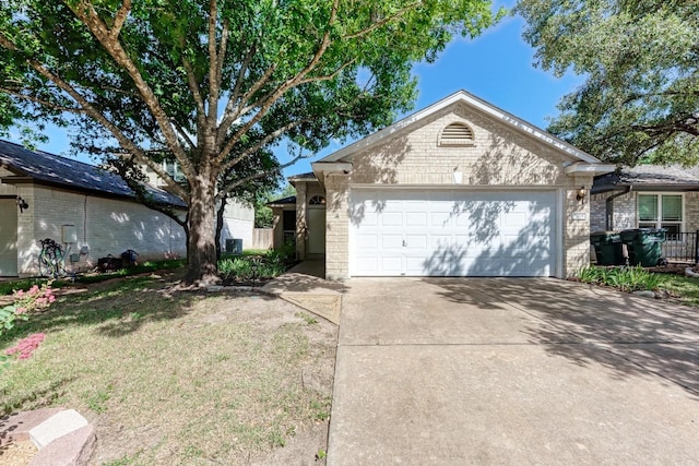 single story home featuring a garage