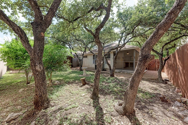 view of yard with a patio and a sunroom