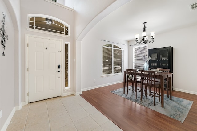 foyer featuring a notable chandelier and light tile patterned floors