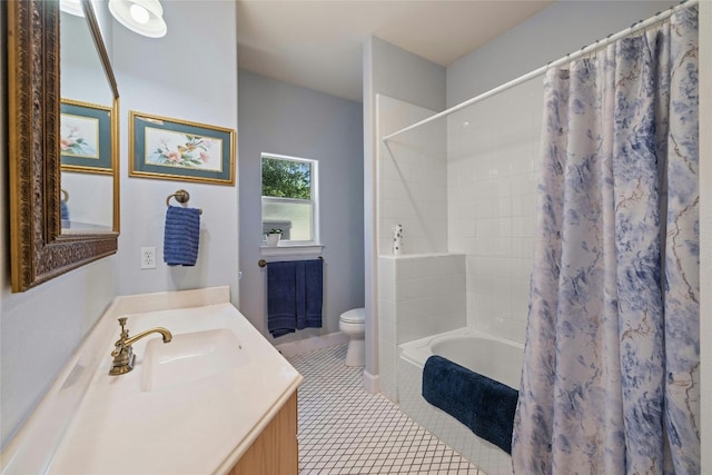 bathroom with tile patterned flooring, vanity, and toilet